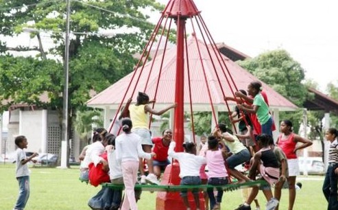 children playing on merry-go-round
